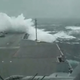 Illustration for article titled Watch Giant Waves Crash Over The Bow Of A U.S. Super Carrier